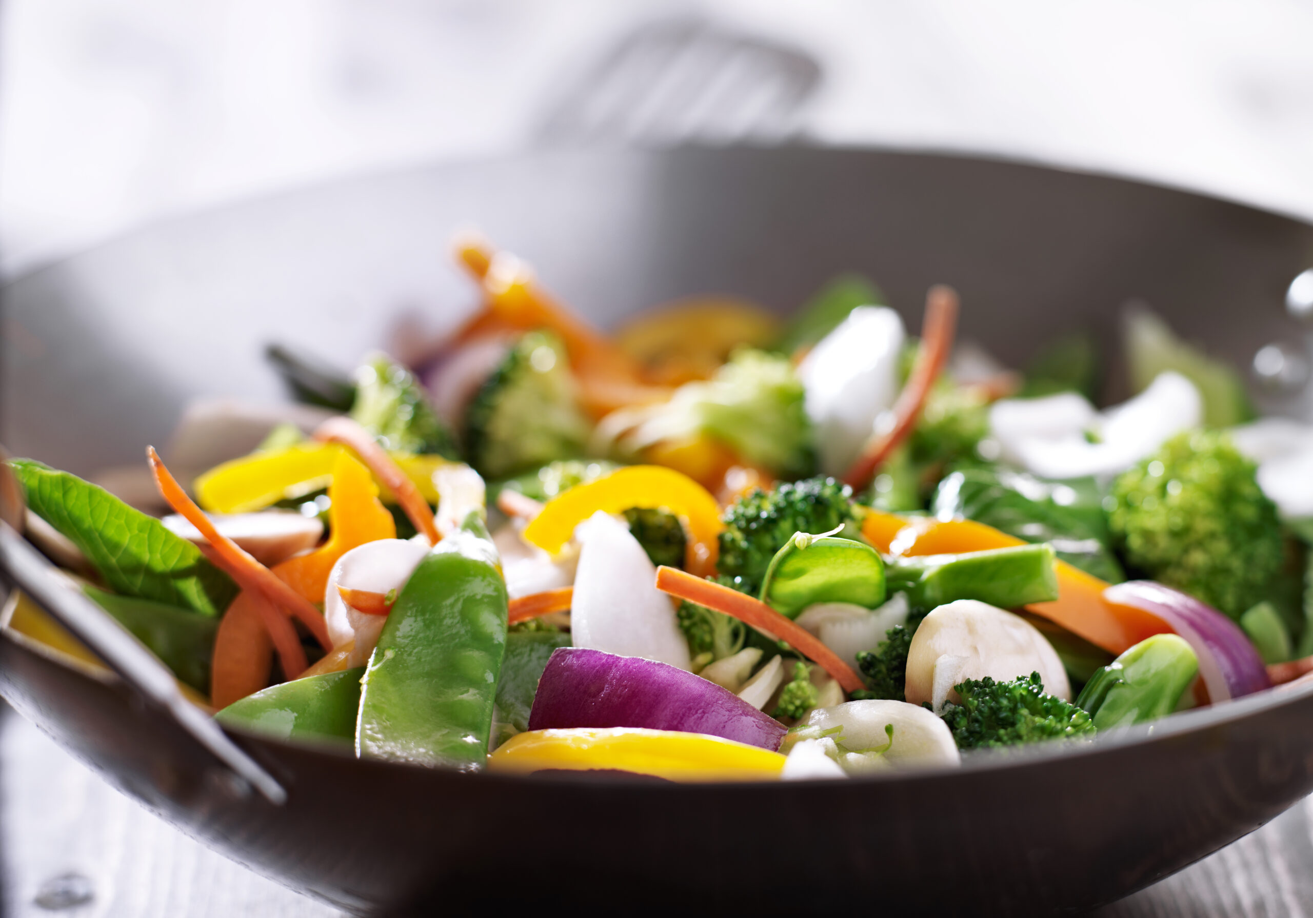 Fresh stir-fry vegetables in a wok